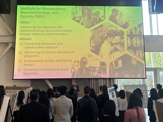 Chris Rozell is giving the opening remarks at the ATL Neuro Networking and Symposium Night.